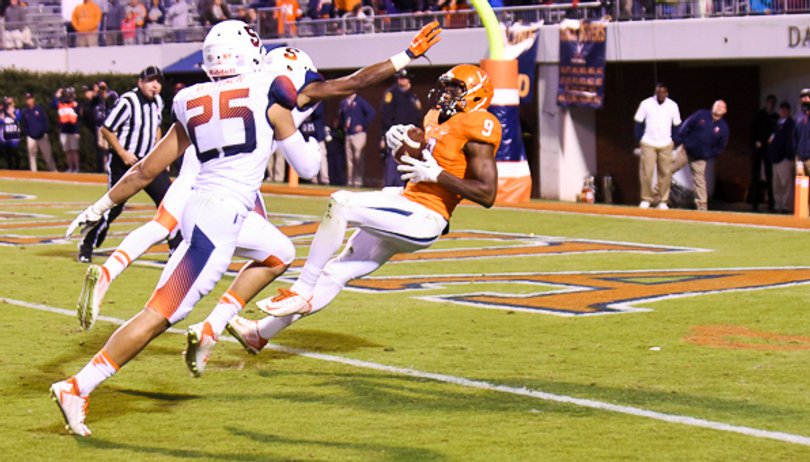 Virginia wide receiver Canaan Severin falls into the end zone after beating two SU defensive backs for a touchdown in overtime. The catch tied SU and UVA at 31 in the first overtime period. 