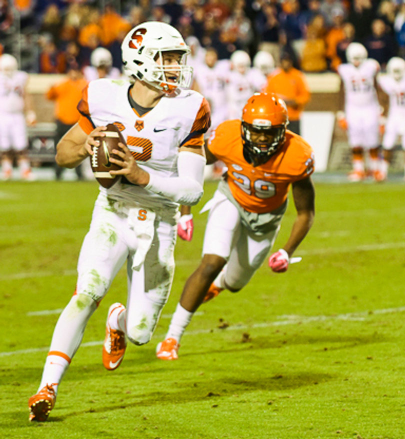 Cavaliers linebacker Eric Gallon chases down SU quarterback Eric Dungey. 