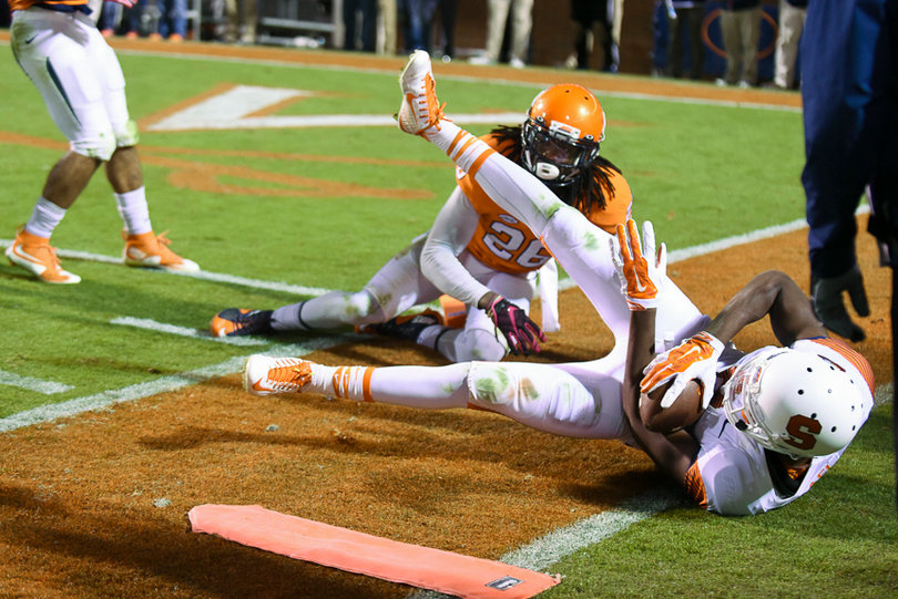 UVA's Maurice Canady looks on as an SU player falls out of bounds with the ball. 