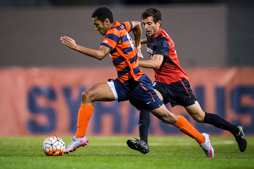 Syracuse forward Noah Rhynhart dribbles past a Hartford defender. He had a shot on goal in the contest.