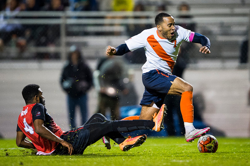 Junior forward Ben Polk avoids a slide tackle. Polk had a shot against the Hawks on Tuesday night.