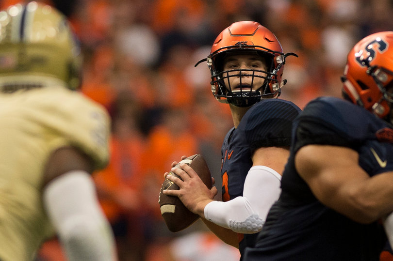 Dungey looks for a receiver during Syracuse's 23-20 loss. He left the game briefly during the third quarter, but finished with 210 yards, two touchdowns and two interceptions. 