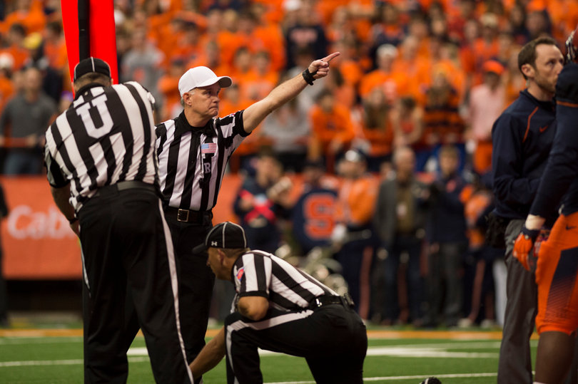 A referee signals for a Pittsburgh first down, which was later overturned after a review. 