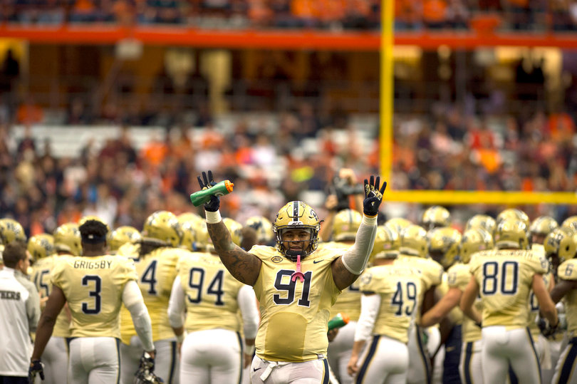 Pittsburgh defensive lineman Darryl Render raises his hands during the Panthers' 23-20 loss. 