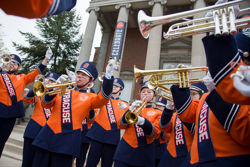 The SU Marching Band's trumpet section plays on the Quad. 