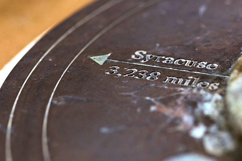 An arrow on a sundial at Lockerbie Academy in Scotland points west to Syracuse, where 35 victims of the Pan Am Flight 103 bombing attended Syracuse University. The academy will honor the victims of the tragedy this week. 