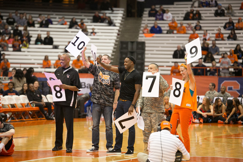 Former SU players Eric Devendorf (second from left) and Scoop Jardine (third from left) judged the dunk contest at Orange Madness.