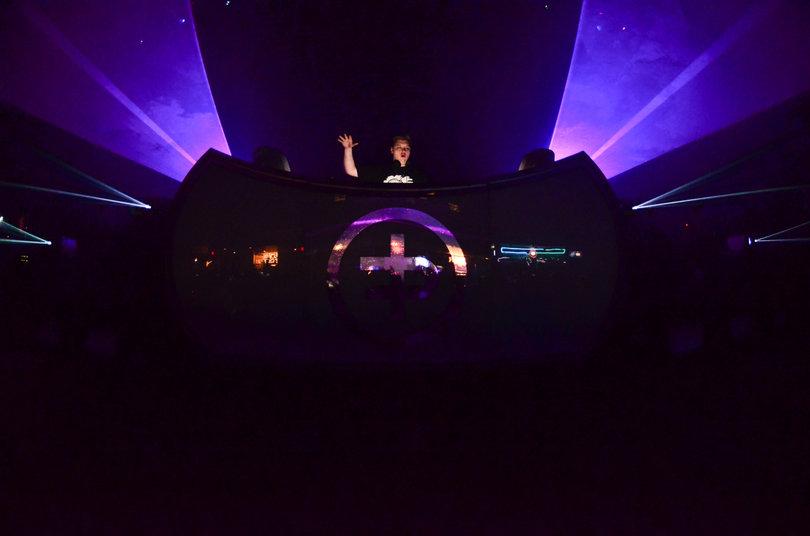 Flux Pavilion jams out behind the DJ booth. 