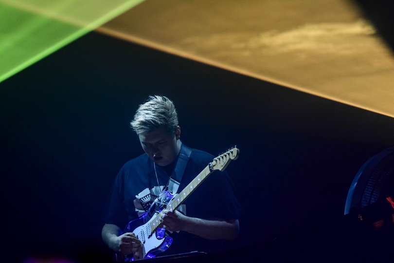 Flux Pavilion, a.k.a. Joshua Kierkegaard G. Steele, is a one-man band. He plays the guitar on stage