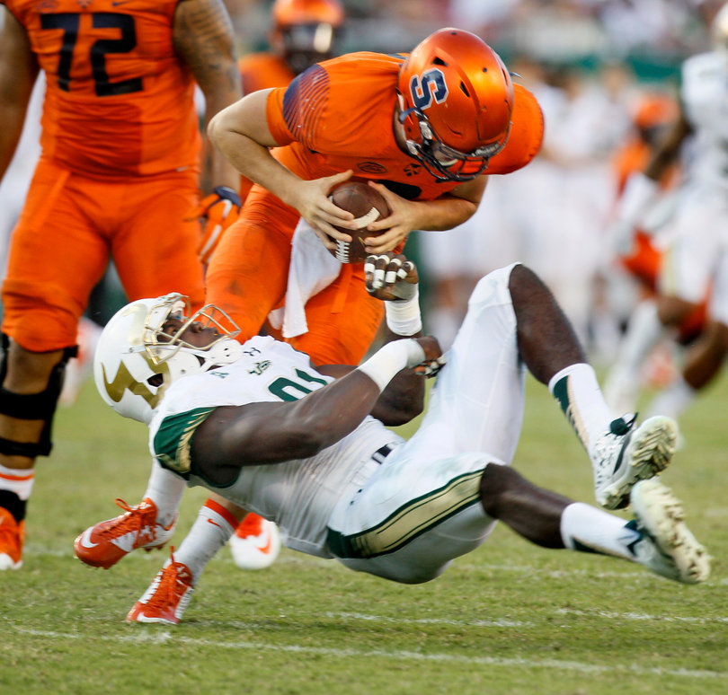 Dungey sheds off USF's Eric Lee but still gets sacked on the play in the fourth quarter.