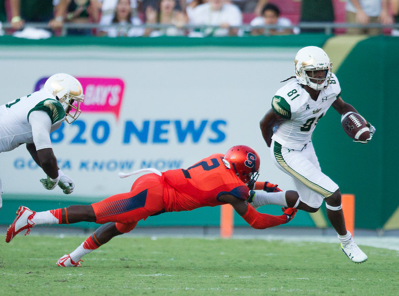 South Florida wide receiver Ryeshene Bronson (81) avoids the tackle from cornerback Wayne Morgan (2) to get a first down in the third quarter.
