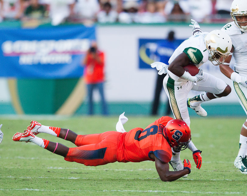 USF wide receiver Chris Barr runs the ball past Syracuse safety Antwan Cordy in the fourth quarter.