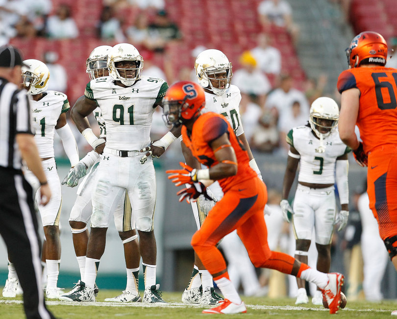 Lee (91) watches the replay on second down during the fourth quarter. USF's defense pressured Dungey throughout the game.