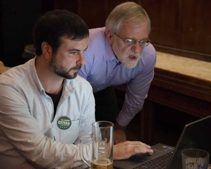 Frank Cetera, Green Party city council candidate, and Howie Hawkins, Green Party city auditor candidate, check their election standing during an election result party at the Syracuse Polish Home. The Green Party had five candidates on the ballot and none were elected. 