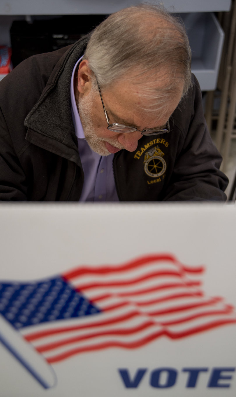 Howie Hawkins, Green Party city auditor candidate, casts his vote at the Kirk Park Community Center. The polls opened at 6 a.m. and closed at 9 p.m. 