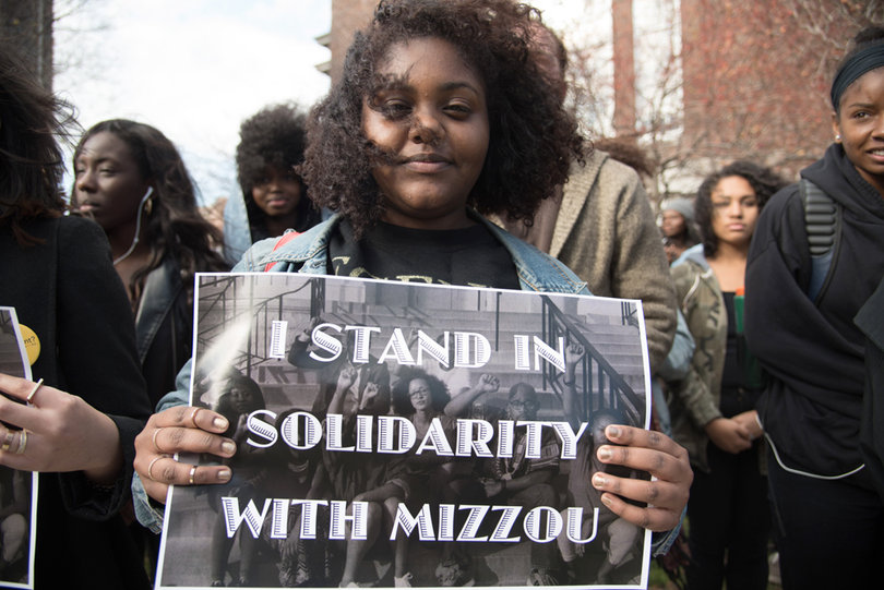 Danielle Alvarez, a sophomore biochemical major at SU from Brooklyn, New York, marches in an act of solidarity with Mizzou on the Quad on Thursday afternoon.