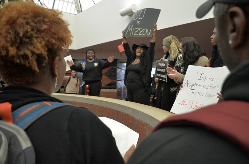 One student holds a sign that reads: "SU is Mizzou" during a protest that took place inside the Schine Student Center.
