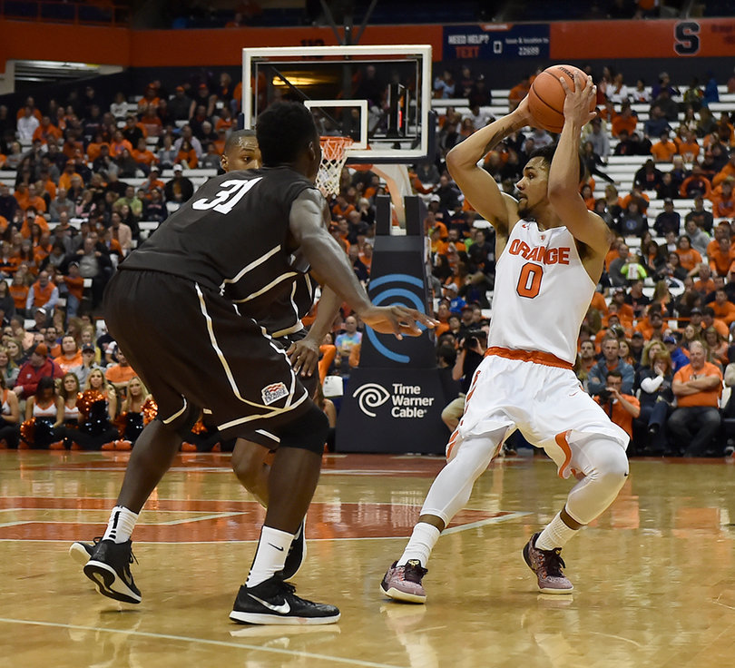 Syracuse guard Michael Gbinije holds the ball and looks for an open pass against Lehigh.