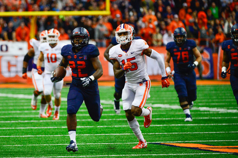 Freshman running back Jordan Fredericks (22) runs away from a Clemson defender. Fredericks left the game with an upper-body injury.
