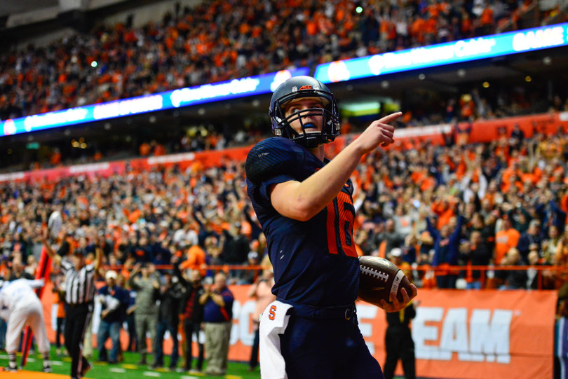 Mahoney stands in the end zone after one of his two rushing touchdowns.