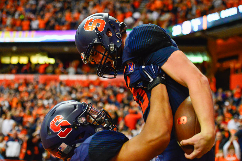 A teammate lifts Mahoney into the air after one of his scores.