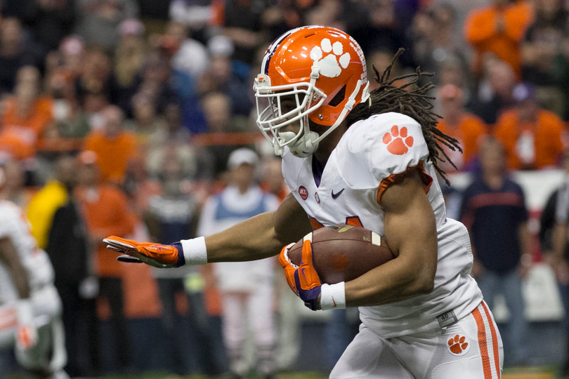A Clemson ball-carrier looks to set up his blockers in front of him.