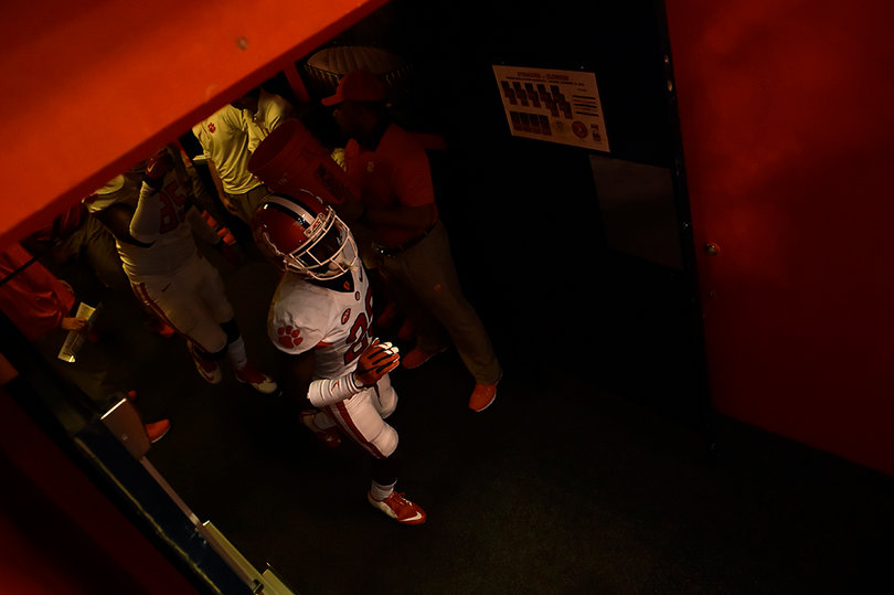 A Clemson player stands in the tunnel outside the locker room.