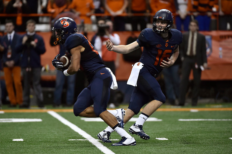 Mahoney hands off to an SU running back.