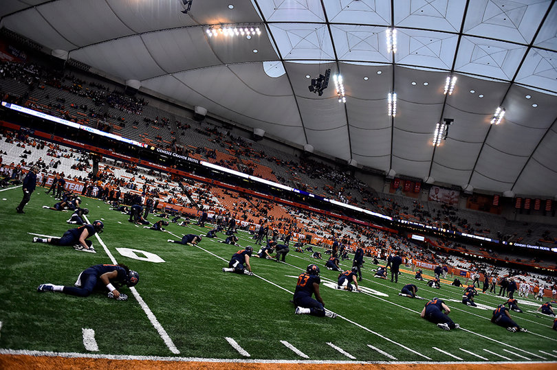Syracuse players stretch before the game.