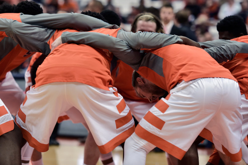 Syracuse players huddle while getting ready for the game. SU came out with the 11-point win.