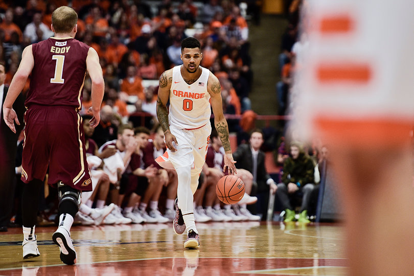 Senior point guard Michael Gbinije dribbles the ball up the court. He finished with 10 points. 