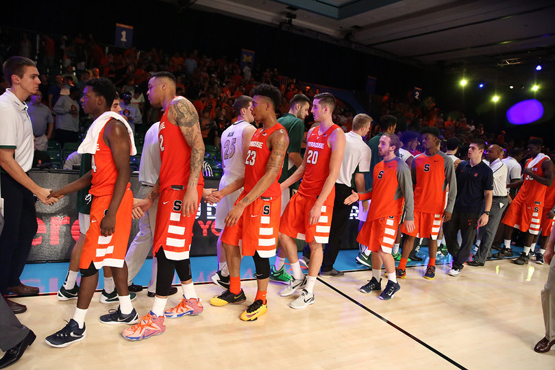 Charlotte and Syracuse shake hands after SU's 83-70 win. 