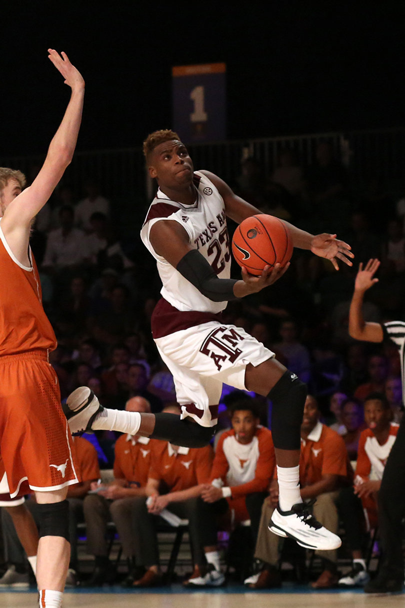 Danuel House leaps toward the hoop to shoot with his right hand.