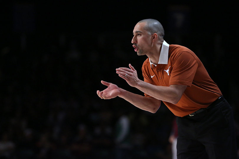 Texas head coach Shaka Smart looks on and claps. He's in his first season at Texas.