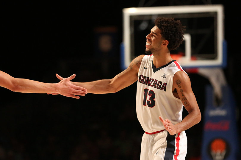 Perkins high-fives a teammate during the Bulldogs' loss. No. 10 Gonzaga dropped to 3-1 on the season.