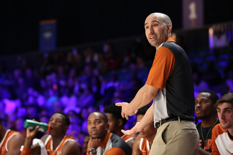 Texas head coach Shaka Smart gives directions to his players on the court. The Longhorns topped Washington, 82-70. 