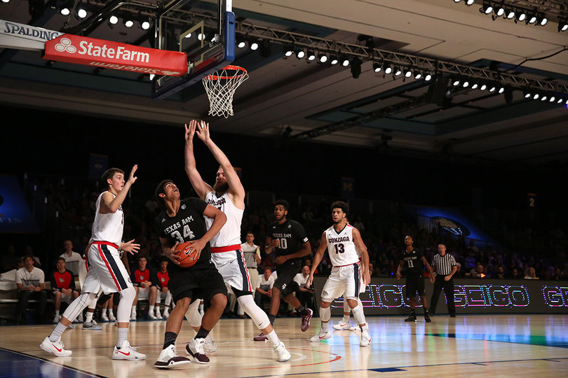 Texas A&M center Tyler Davis looks up at the basket as two Gonzaga defenders loom over him. Davis scored just six points and grabbed two rebounds. 