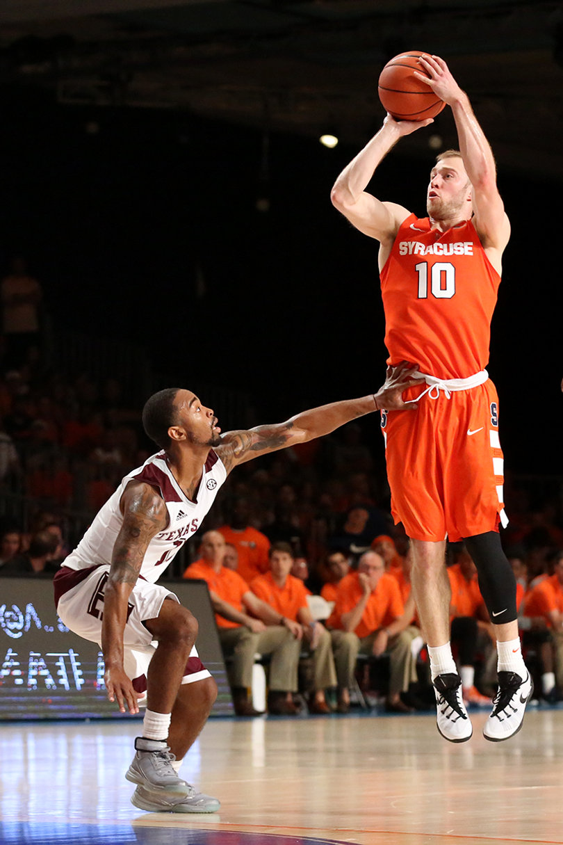 Cooney elevates for a jump shot with the Aggies' Anthony Collins defending him.