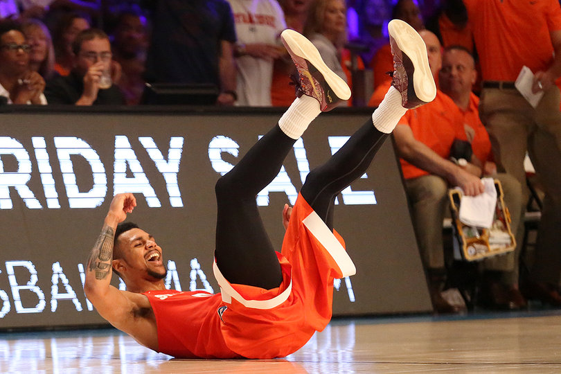 Gbinije smiles as he is fouled by Collins on a 3-pointer with a few seconds left in the first half.