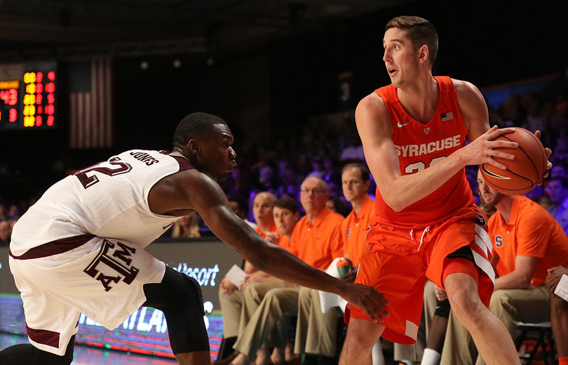Lydon protects the ball as a defender reaches in and provides pressure.