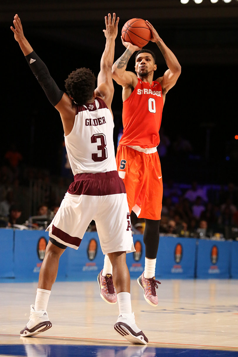 Gbinije unloads one of his 11 field-goal attempts. He won tournament MVP.