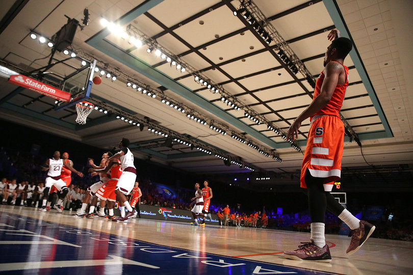 Gbinije stands at the 3-point line after attempting a 3. 