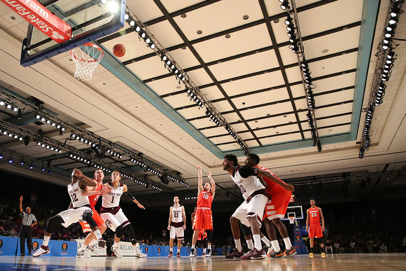 Cooney shoots a free throw as Texas A&M players box out to grab the rebound.