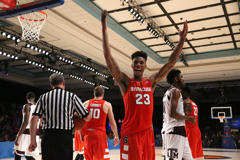 Richardson lifts his arms in the air with the Orange victory just moments away.