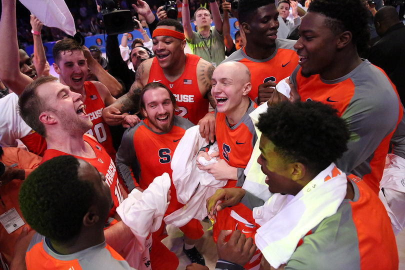 The Orange gather in a mob celebrating the victory.