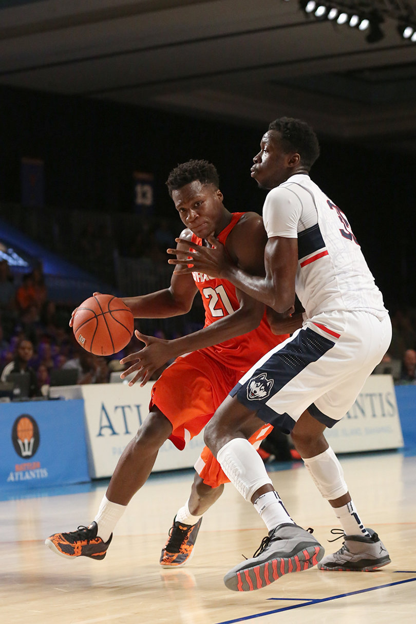 Roberson drives against Brimah. The SU forward is averaging a double-double in the Bahamas, with 20 points and 20 rebounds in two games. 