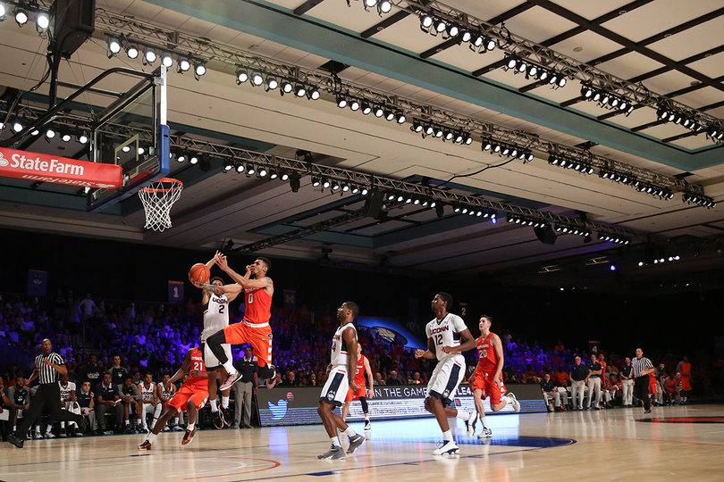UConn guard Jalen Adams (2) tries to block a Gbinije layup. The Syracuse point guard has scored 43 points in the Bahamas, the most of any SU player. 