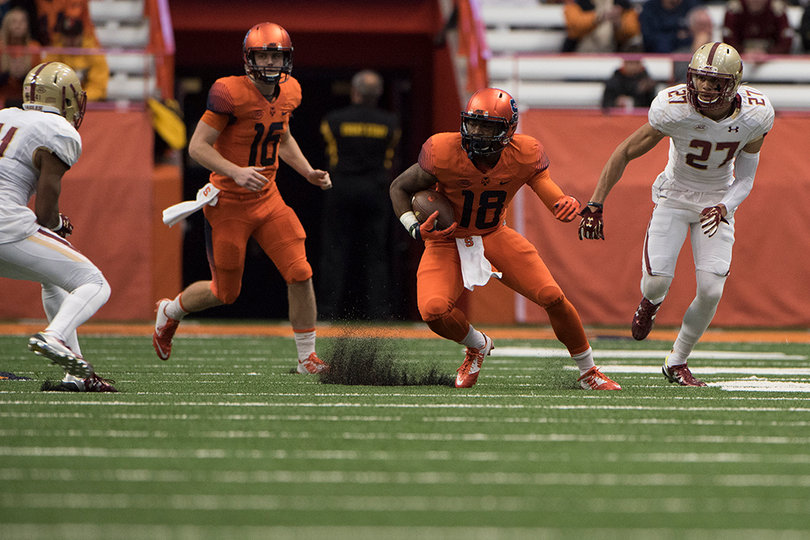 Running back Dontae Strickland switches directions during a run in the first half. 