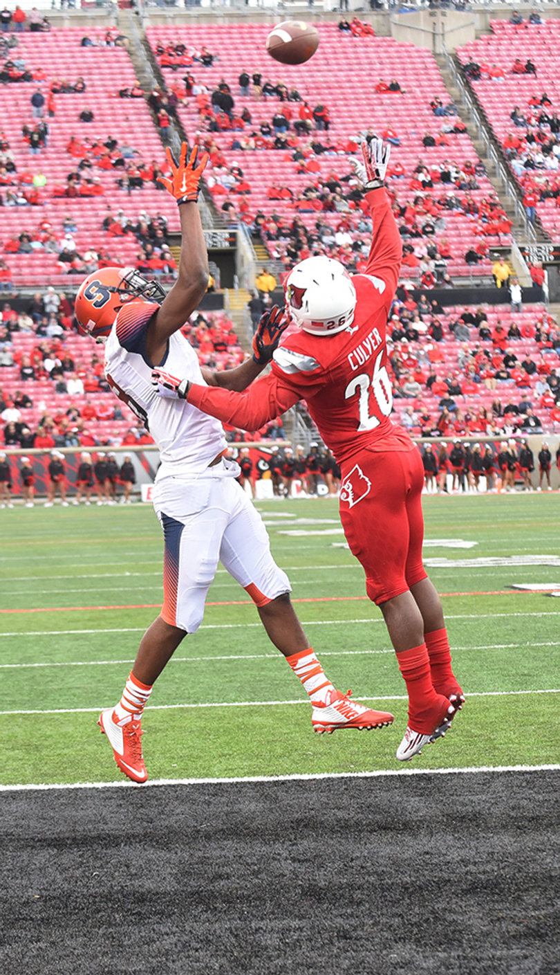 U of L cornerback De'Eric Culver (26) and Orange wide receiver Steve Ishmael leap for a pass. 