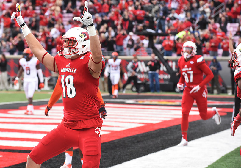Louisville tight end Cole Hikutini celebrates one of his two touchdowns during SU's loss to the Cardinals. 